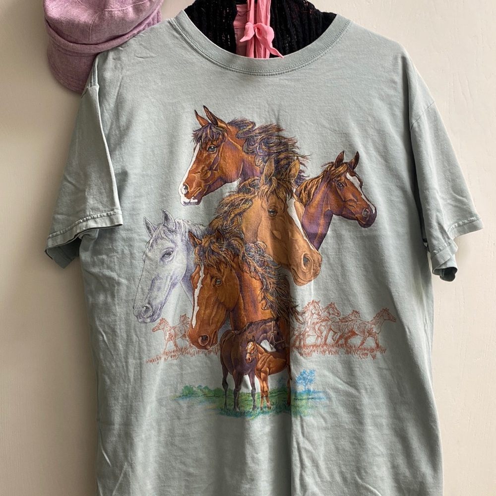 Light green tshirt with beautiful horses on it.